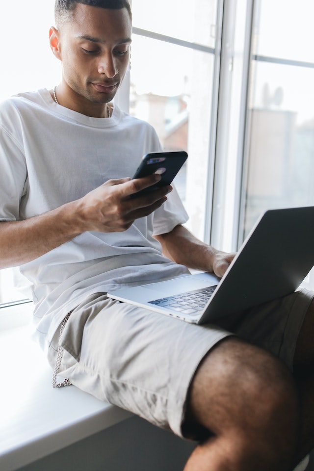 A man searches his DMs for specific instructions from his client.