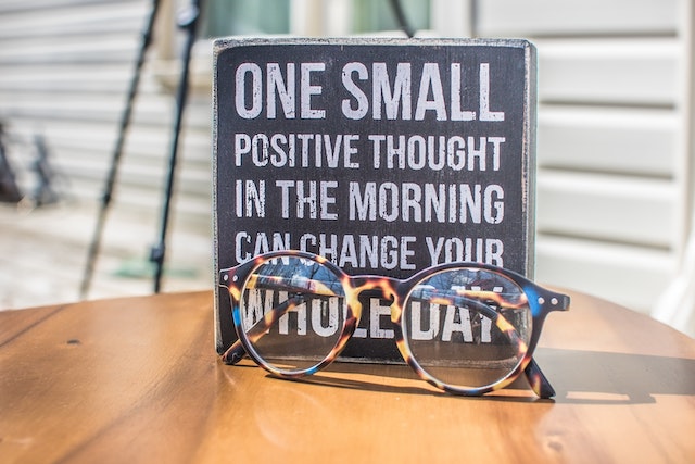 Positive quote signage on a coffee table that can be motivational to people if they read it in an Instagram bio.