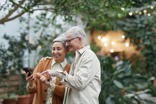 An old couple checking up on new slang terms online. 