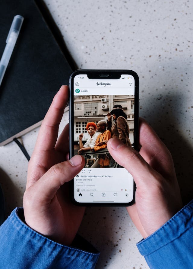An image of a person using Instagram and viewing posts.