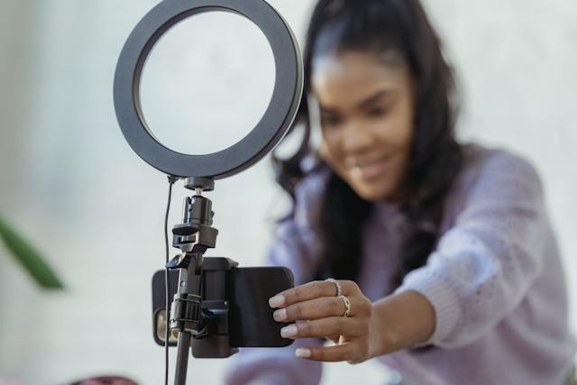 A woman recording a video on Instagram.