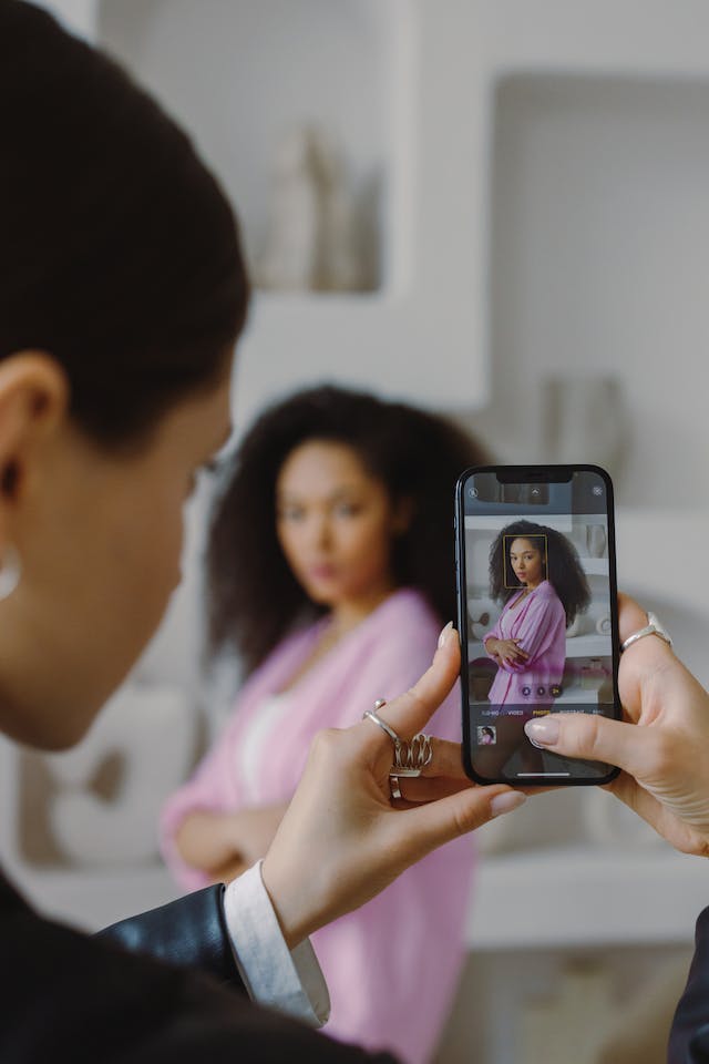 An Instagram content creator takes a photo for her timeline. 