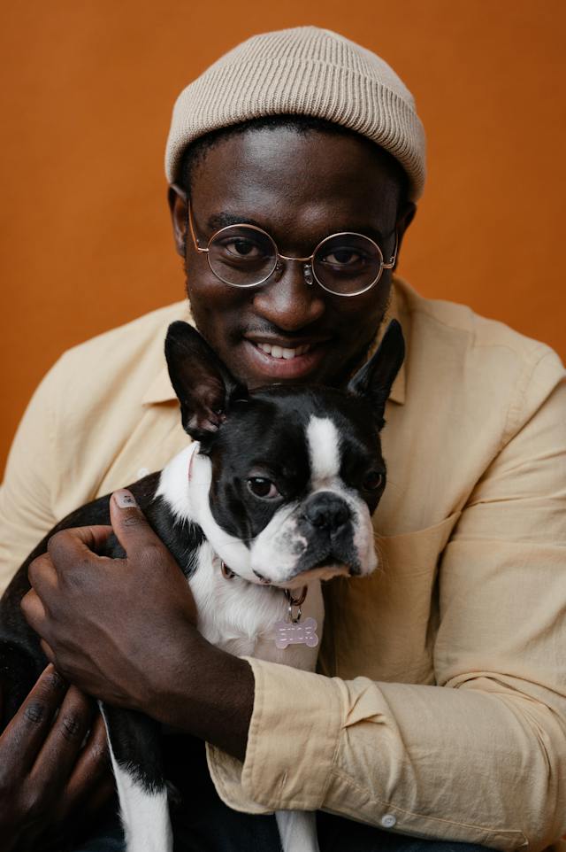 A portrait photo of a man with his dog.