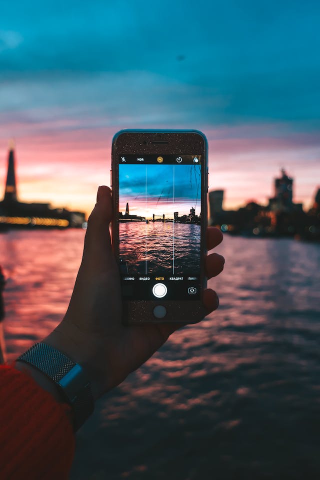 A vacation blogger records the close of her day with a sunset.