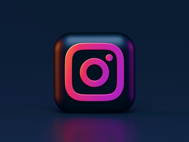A 3D illustration of the Instagram logo on a blue-black background.