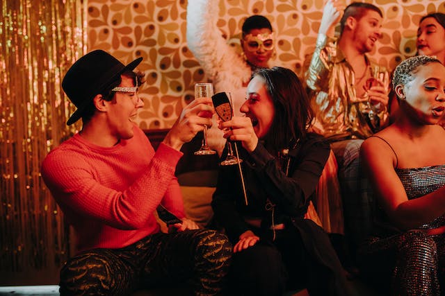 Friends happily having a toast at a New Year’s Eve party.