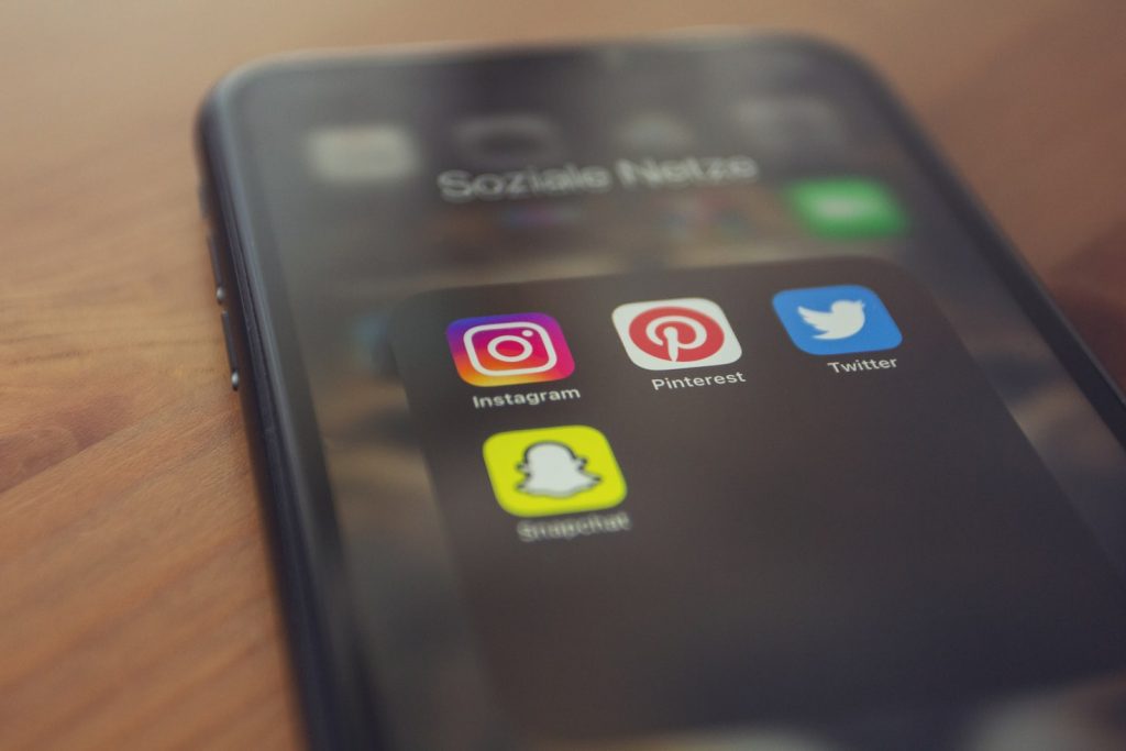 Instagram, Twitter, Pinterest, and Snapchat applications on the phone. 