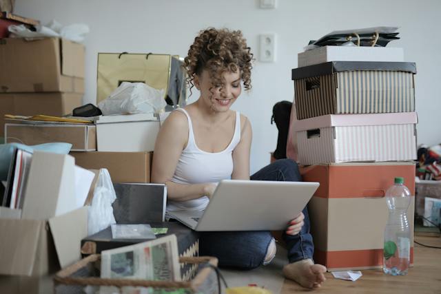 A female content creator smiles as she plans her organic growth strategy. 