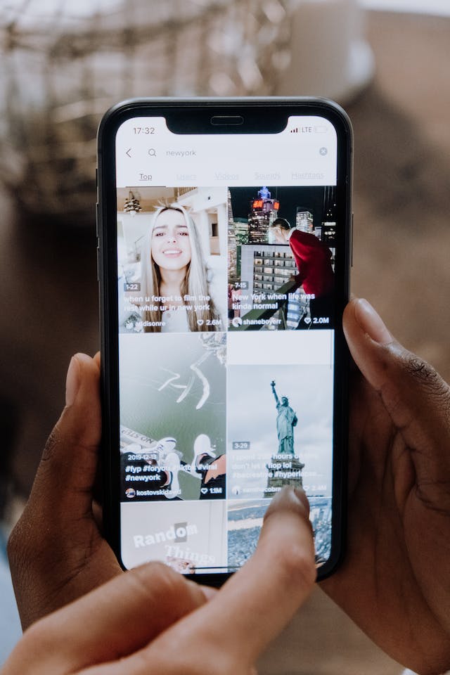 A person is viewing Reels on his iPhone.