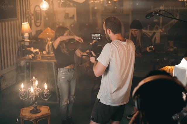 A band recording a video in a garage for an Instagram Reel.