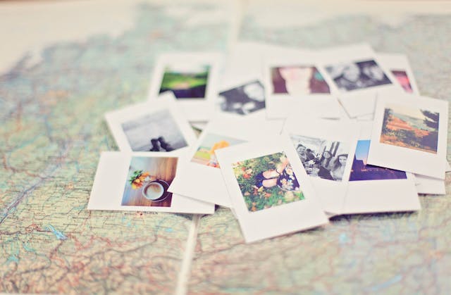 A set of photos on top of a world map.