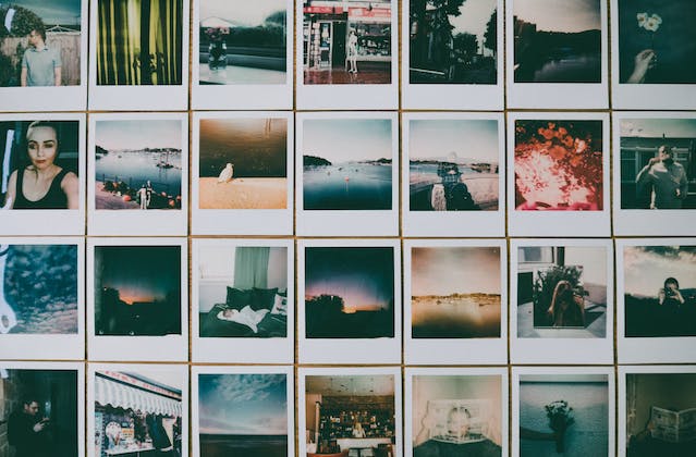 Cool Polaroid photos neatly placed on a table in rows.