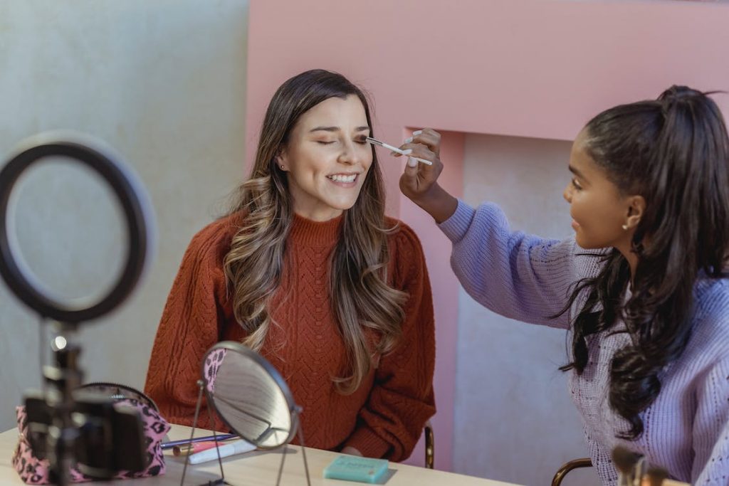 A beauty blogger recording a make-up tutorial reel. 