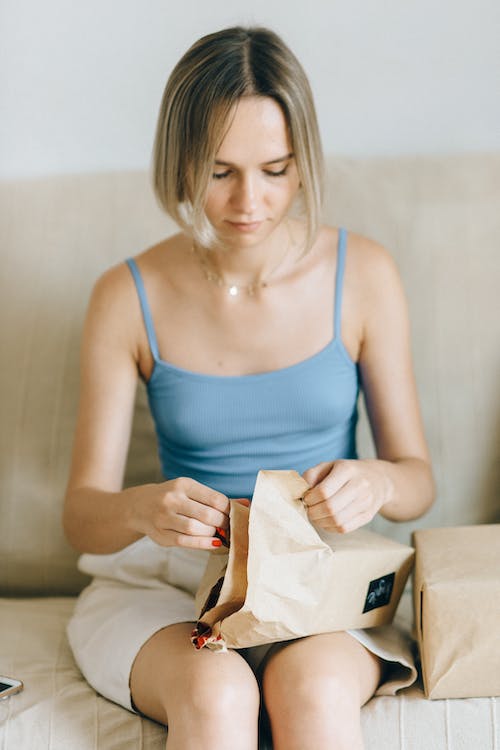 A girl unpacking a parcel.