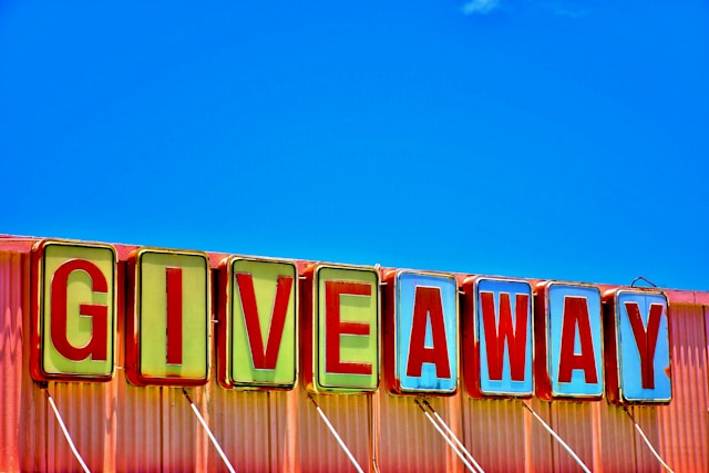 A colorful warehouse sign that says “GIVEAWAY.”