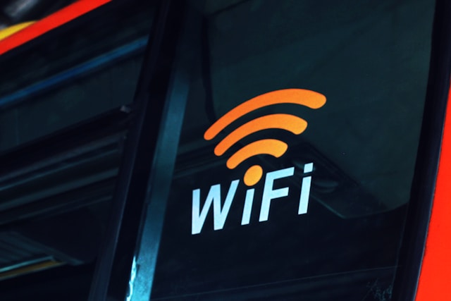 A lit-up Wi-Fi sign on the side of a bus.