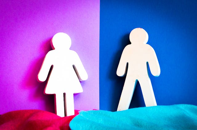 pexels-magda-ehlers-pexels-1386336 | Path Social Cutouts of female and male symbol decals against pink and blue backgrounds, respectively.