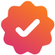 Pictogram van een wit vinkje in een badge met rood-oranje kleurverloop, dat authentieke inzichten symboliseert.
